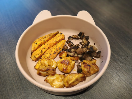 Baby plate of cajun chicken with sweet potato wedges and mushrooms